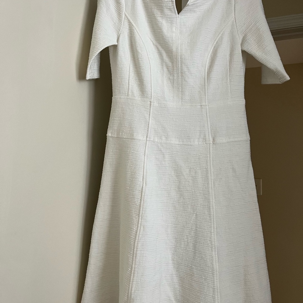Never worn. Lovely dress with lining. A line. Fits beautifully.